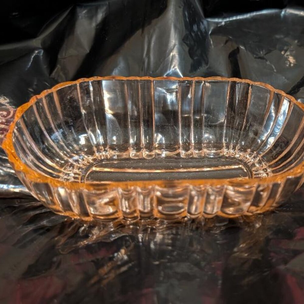 Pink Depression glass oval dish with scrolled handles in the 'Old Cafe' pattern